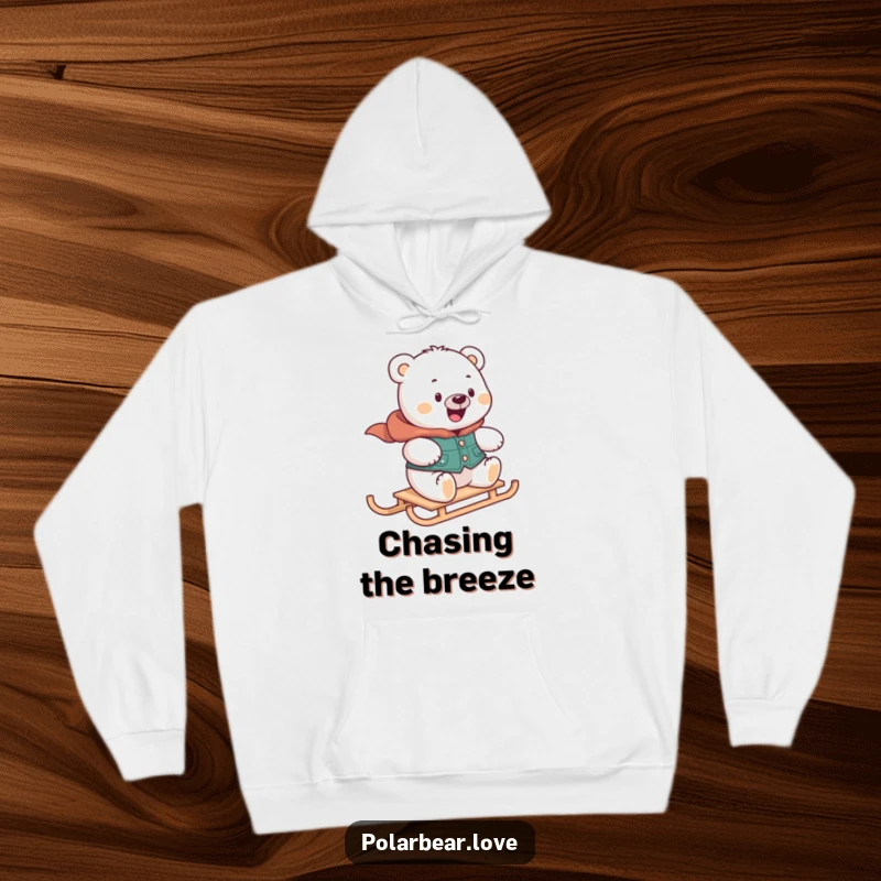 Funny polar bear hoodie in a vest, looking delighted while zooming on a mini sled, perfect for cozy winter gifts.