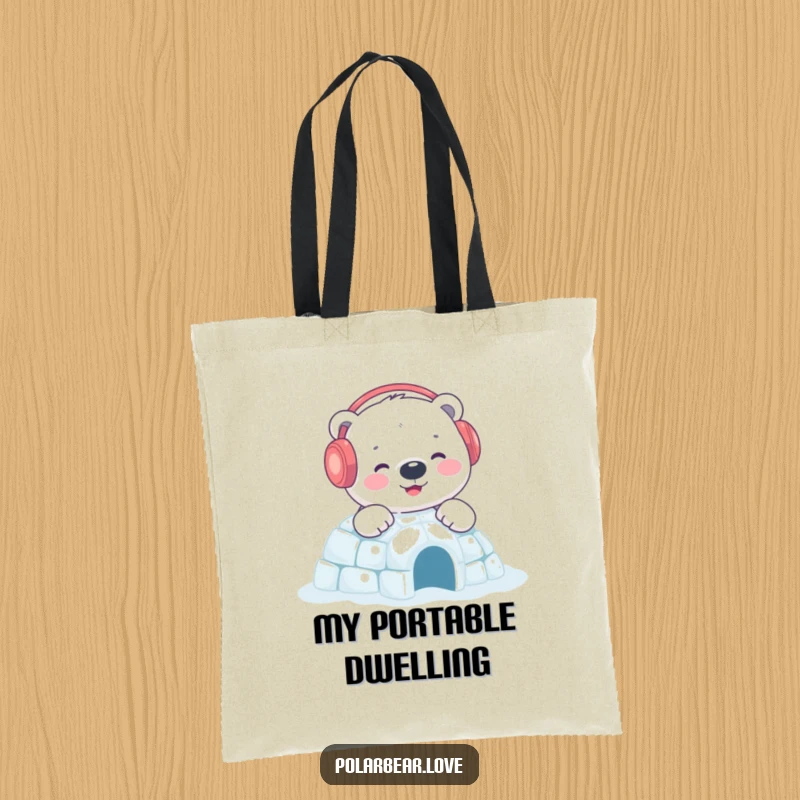 Funny polar bear igloo tote bag featuring a content bear with earmuffs building a sparkling igloo, a charming accessory for winter.